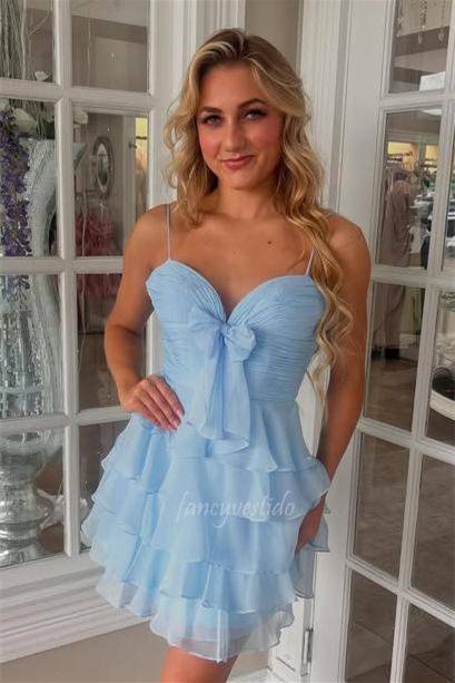 This Spaghetti Straps Pleated Ruffle Homecoming Dress features delicate straps that frame the shoulders with subtle elegance. The pleated fabric adds texture and sophistication, while the ruffle detailing introduces a dynamic, feminine flair. A carefully placed bow accentuates the waist, providing a polished finishing touch. Designed to combine graceful movement with refined style, this dress is ideal for making a memorable impression at your homecoming event.