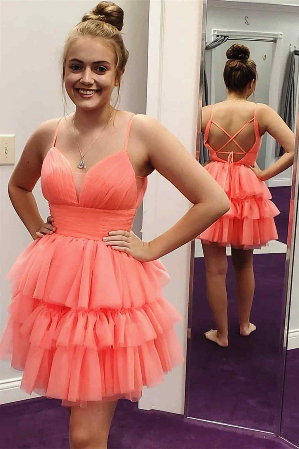 This tight short homecoming dress features hater neckline and sequins