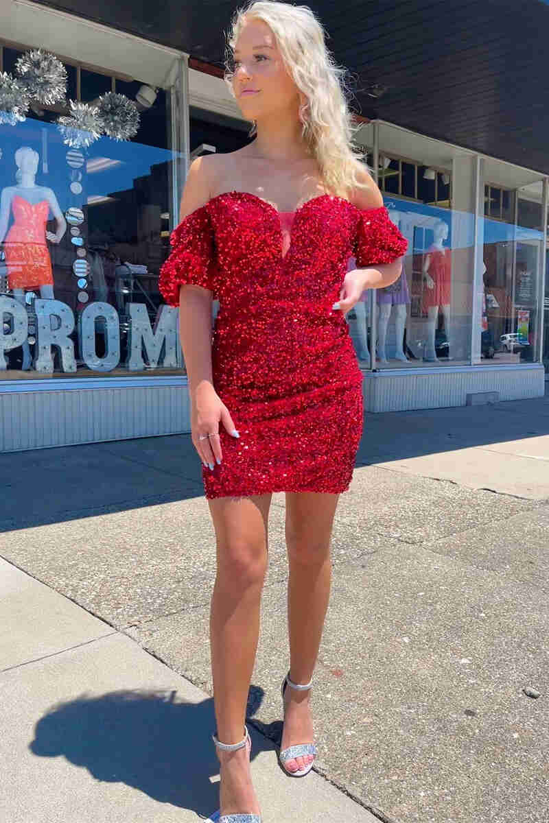 This tight short homecoming dress features hater neckline and sequins