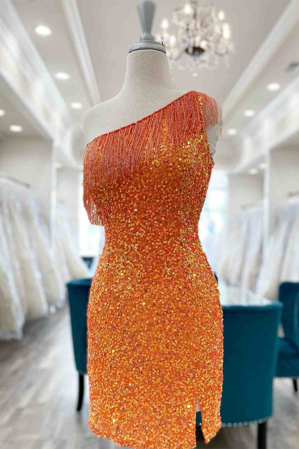 This tight short homecoming dress features hater neckline and sequins