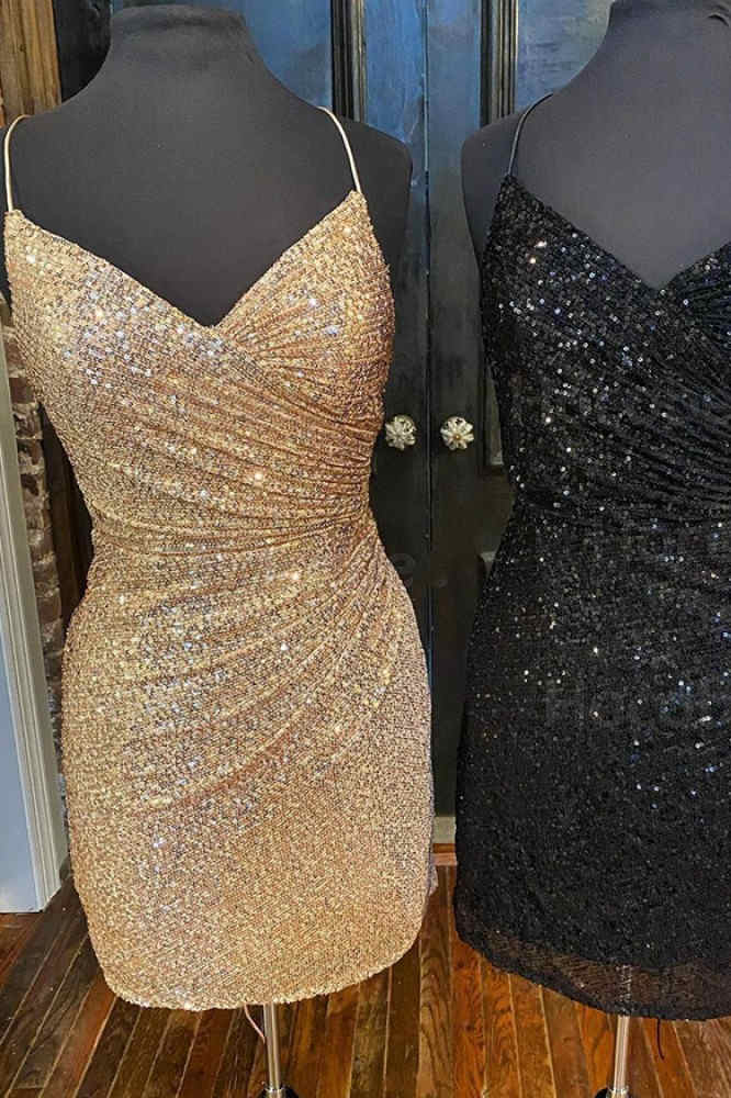 This tight short homecoming dress features hater neckline and sequins.   FancyVestido